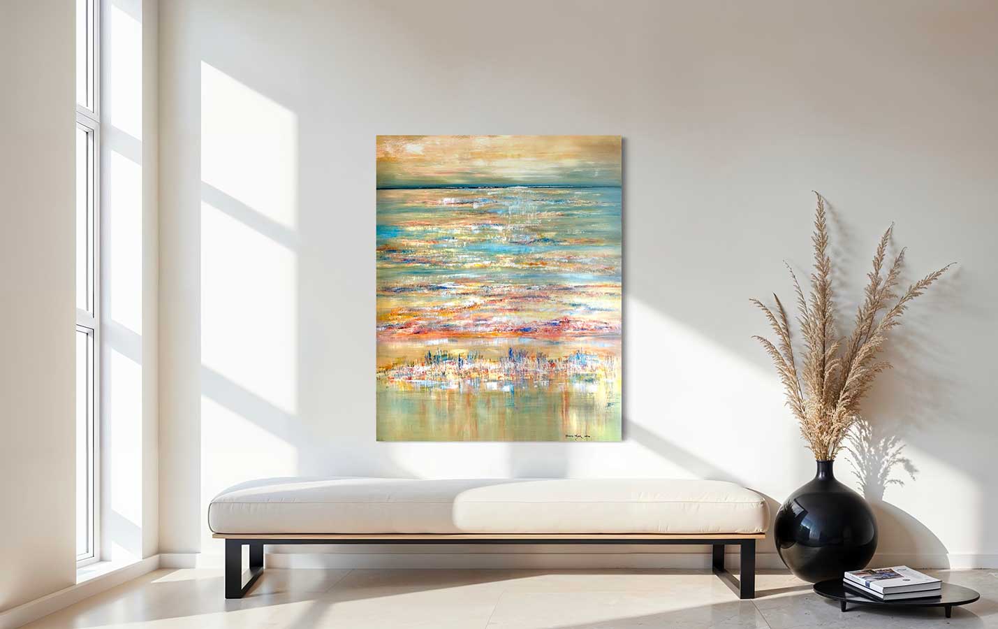 Abstract painting on a wall in a modern living room with a vase and books on a table.